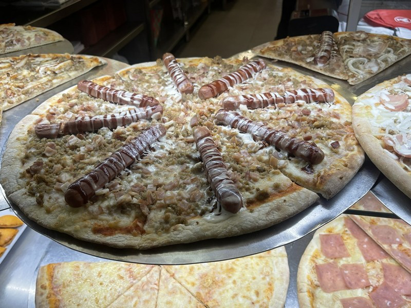 Hot Dogs on This Pizza We Saw in the Window