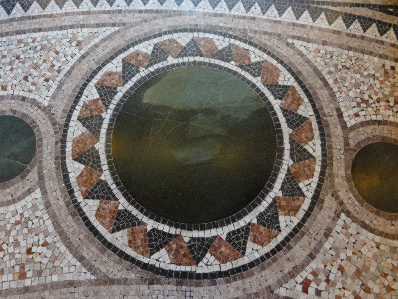 Mosaic in the floor of the entrance way.