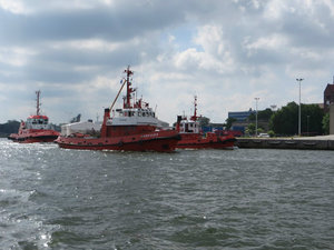 Being Followed by Many Tugboats