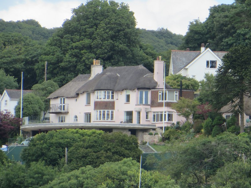 A Thatched Roof House Along the River Dart