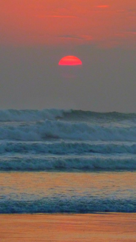 Sunset with rolling waves