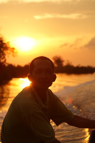 Boatman at sunset