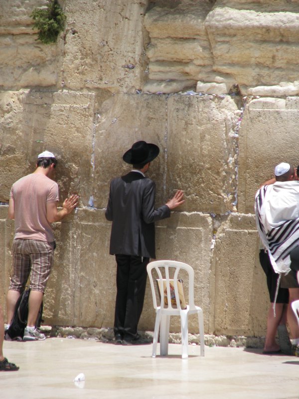 Praying in front of the Western Wall