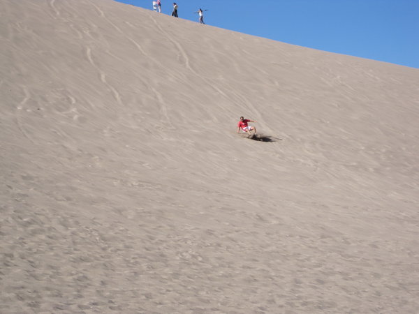 Sandbording on a giant dune