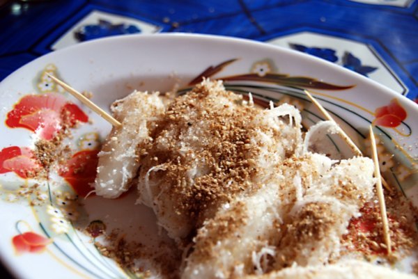 Cambodian sweets!  Rice paste covered in shredded coconut, sugar and cinnamon