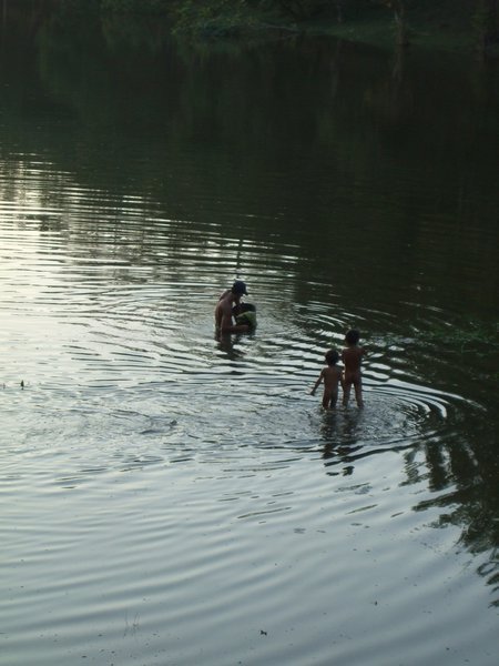 locals bathing in the river near South Gate