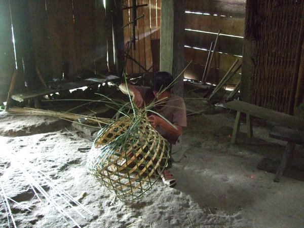 man weaving basket