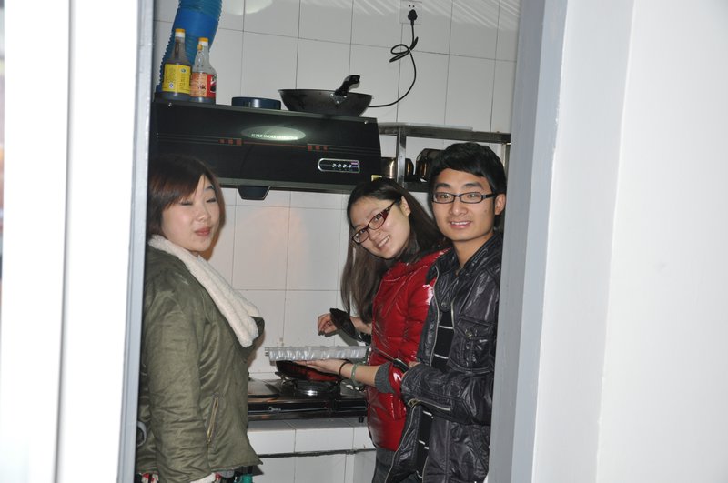 Chain, Crystal & Nathan cooking dumplings for us