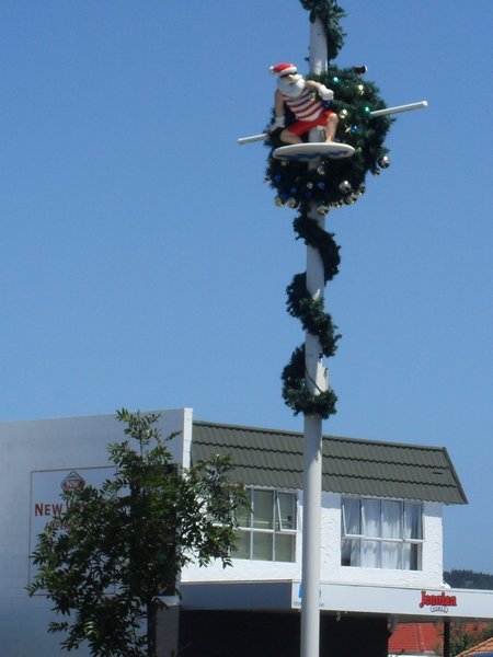 Surfing Santa on a lamppost!