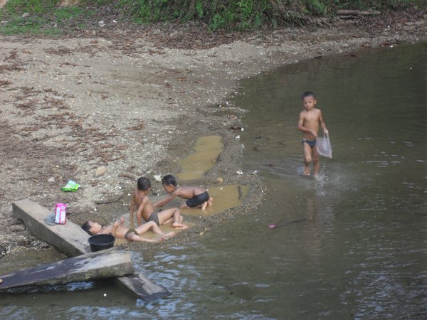 Children playing in the stream