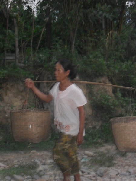 Woman carrying her goods