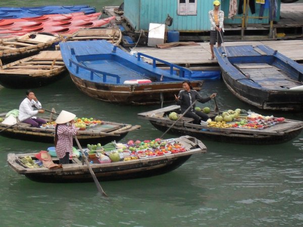 Women selling fruit from their boats