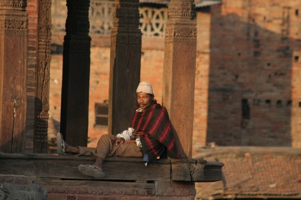 Superman's Nepali Half Uncle takes a break on top of a temple, Baktaphur
