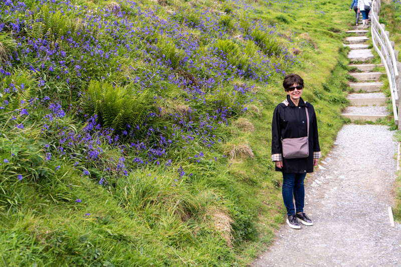 Jennie with wildflowers, Tintagel Castle
