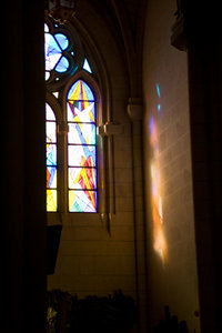 Church windows with light on wall