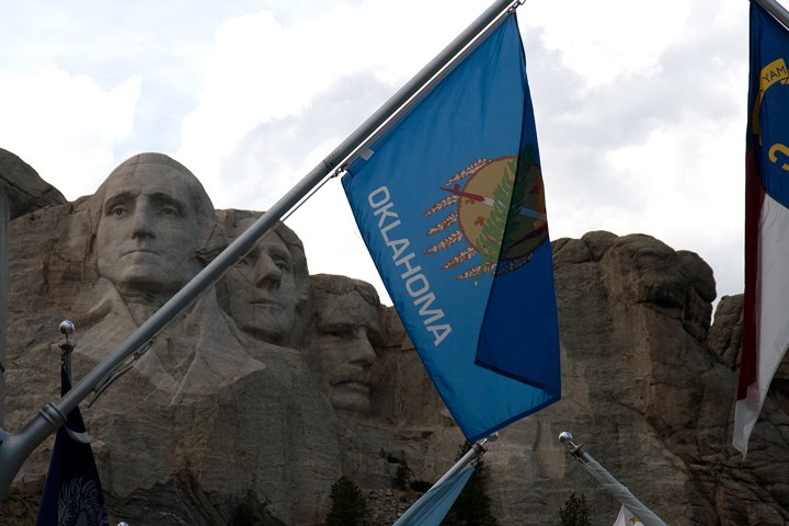 Mt. Rushmore with Oklahoma flag