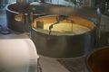 Cooking curds and whey to make gruyere cheese