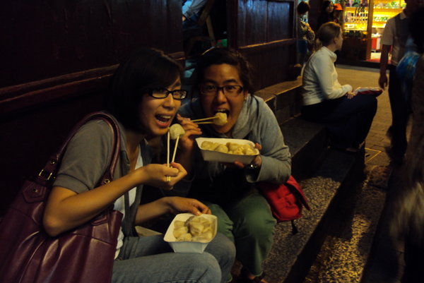 sitting on some steps...devouring our siu long bao's
