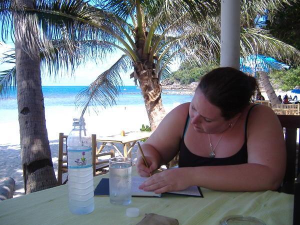 Manda writing diary over lunch