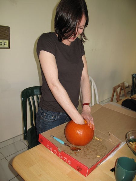 and Sarah carving a pumpkin