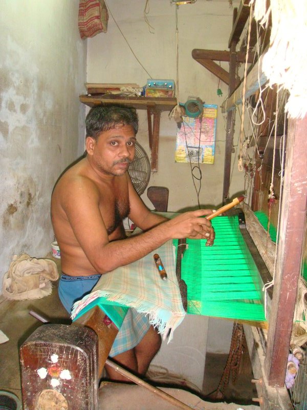 Loom operator making silk garments
