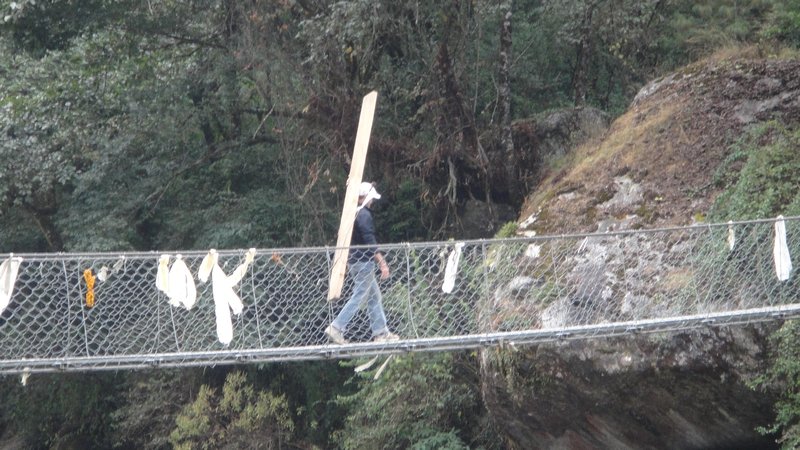 Crossing swing bridge with timber