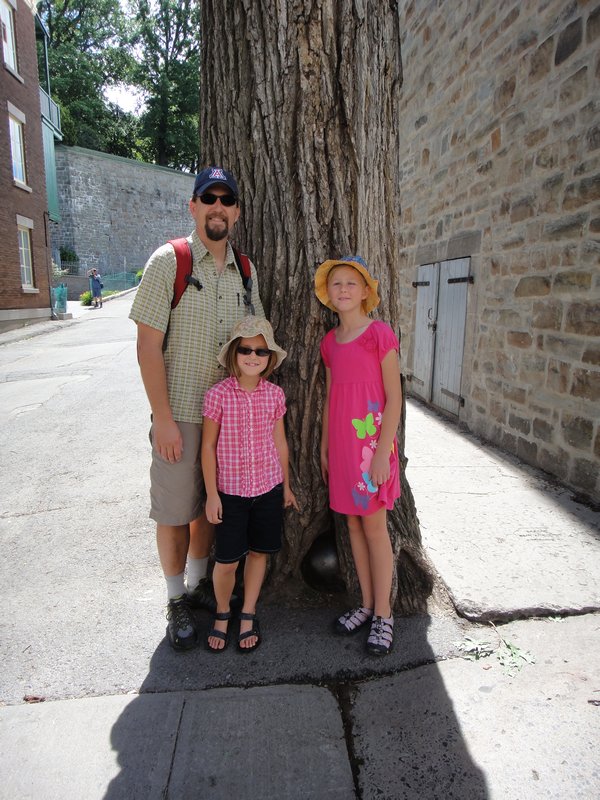 Dan, Arden & Madeleine with the cannonball at the base of the tree (according to legend, this cannonball landed here during the War of 1759).