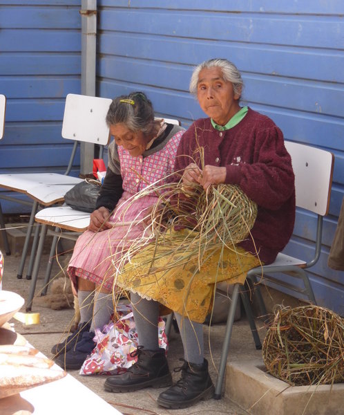Ichuac locals making basket the traditional way
