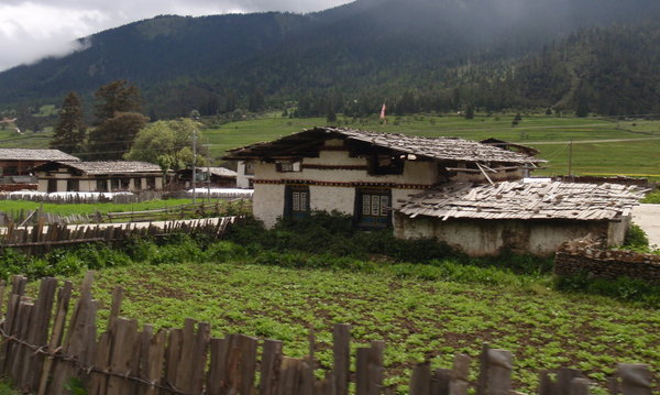 Lunang, a logging town with traditonal wooden roof shingles held down by stones. 