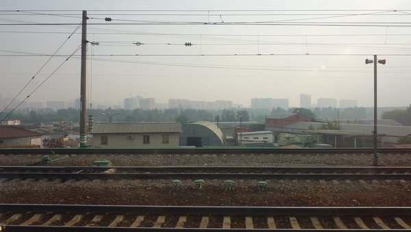 suddenly the forest disappears and, a hazy, Moscow appears
