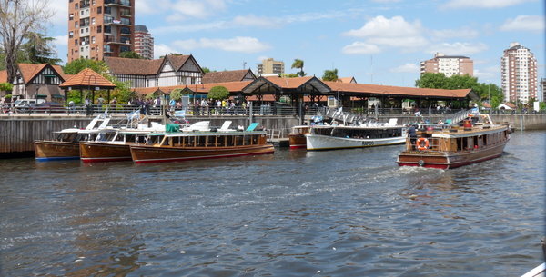 smart mahogany river taxis waiting to whisk you along the waterways