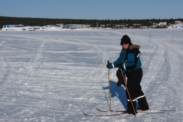 Skiing across the river Torne