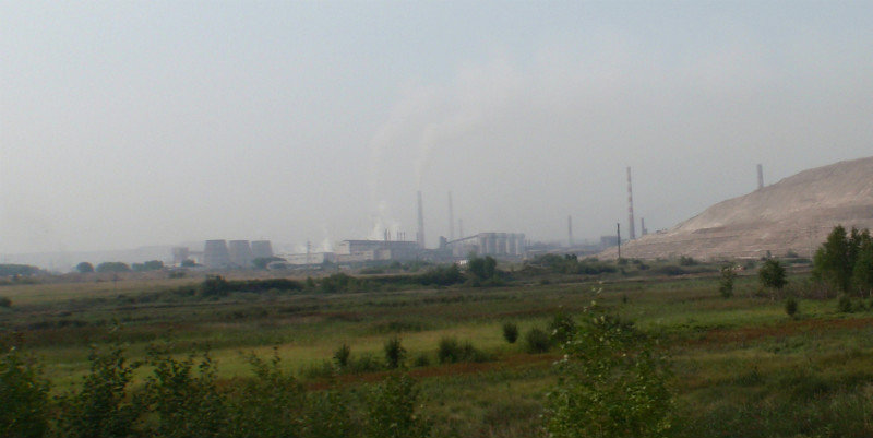 the town of Achinsk starts to emerge from the smog