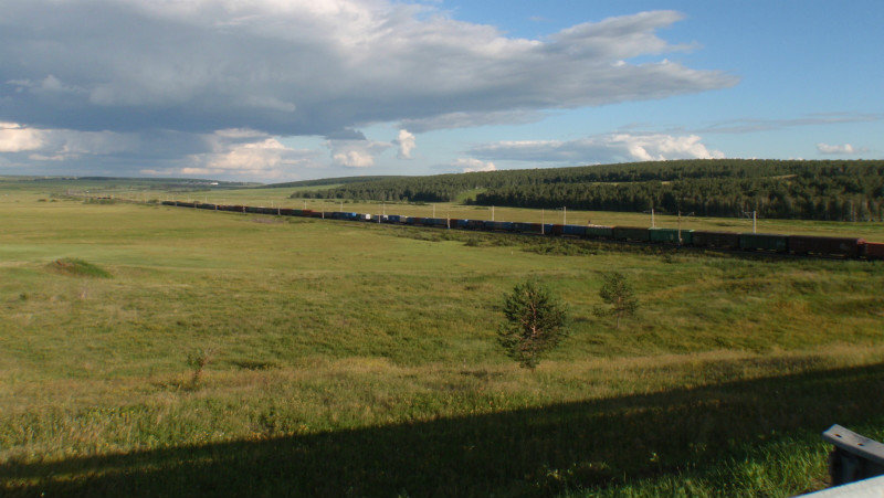 another vast train snaking its away across the vast landscape