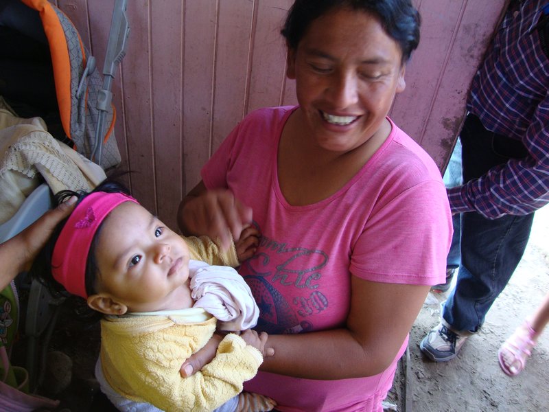 El Salvador, woman,child in soup kitchen