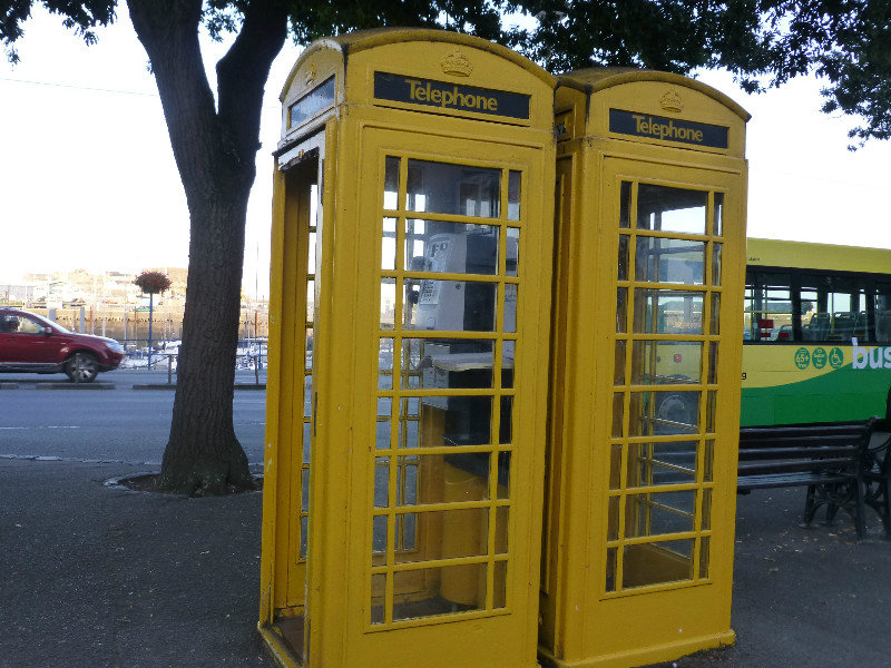 yellow phone booths at the bus terminal