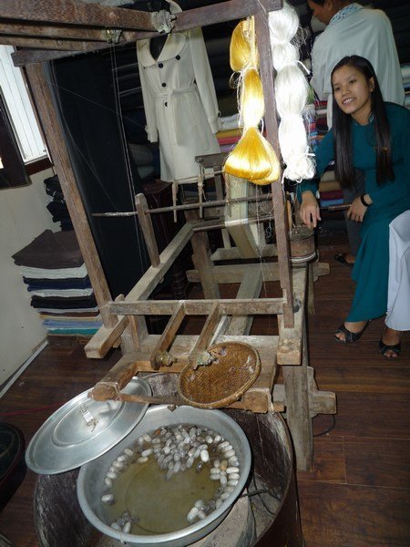 Extracting fine silk thread from the boiling silkworm cocoons