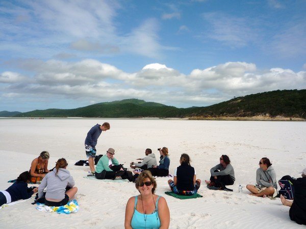 Group settle on Whitehaven Beach