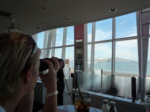 Joy uses our chained-up binoculars to view SF Bay 