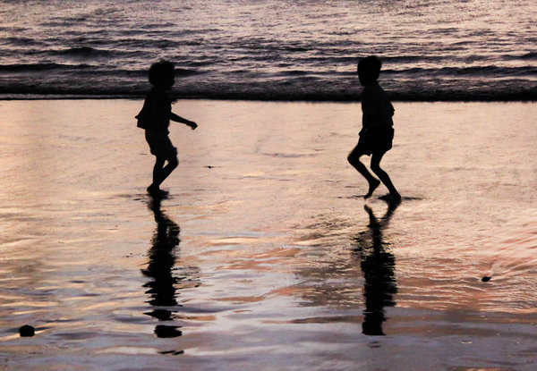 Kids playing at Kuta beach