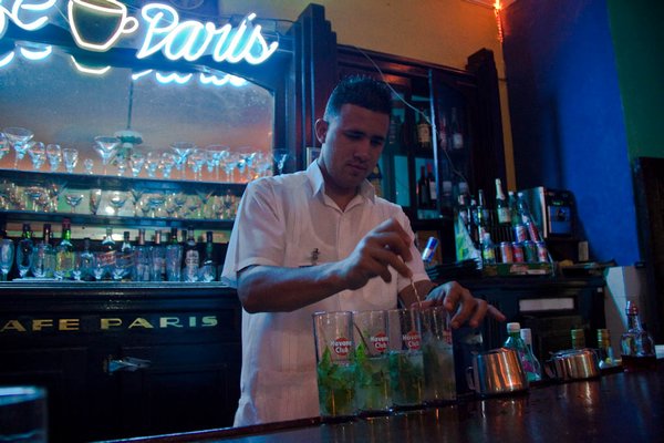 Barman making mojitos in Cafe Paris