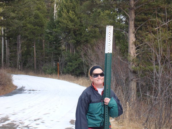 Liz and snow pole
