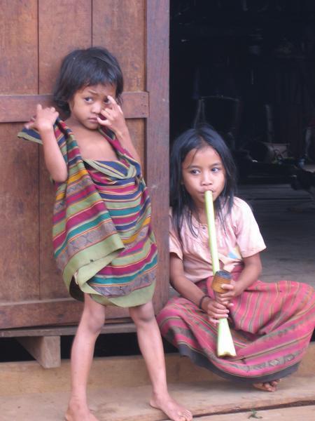 Children smoking at animist minority village