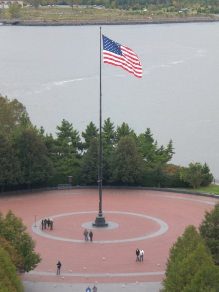 The American flag flying proud on Liberty Island