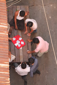 Locals playing cards in the street