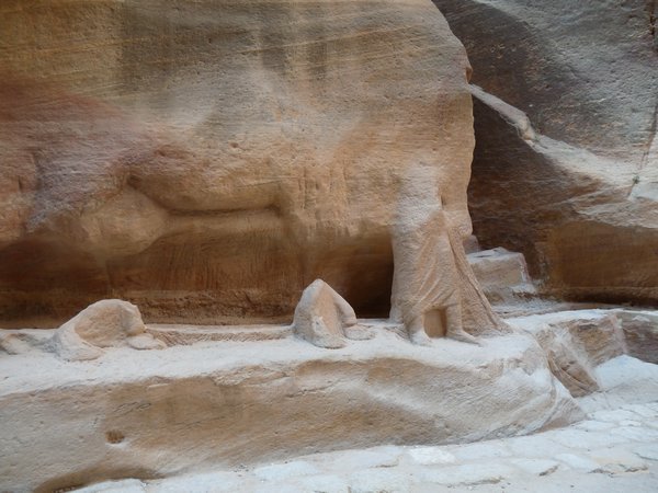 Petra - remnants of camel train carved on the rock face
