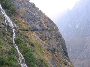 path going through waterfall