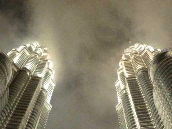 Mist obscures the top of the Petronas towers