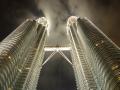 Clouds drift around the Petronas towers