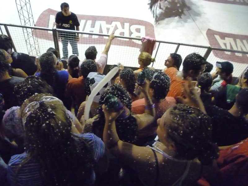 The crowds covered in snow spray